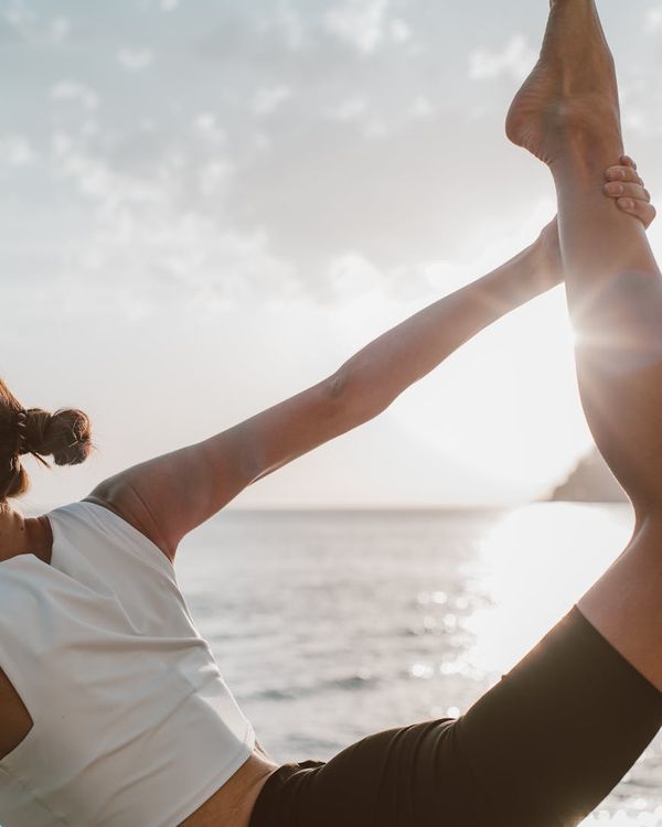 Woman in a calm yoga pose, embodying harmony and balance.